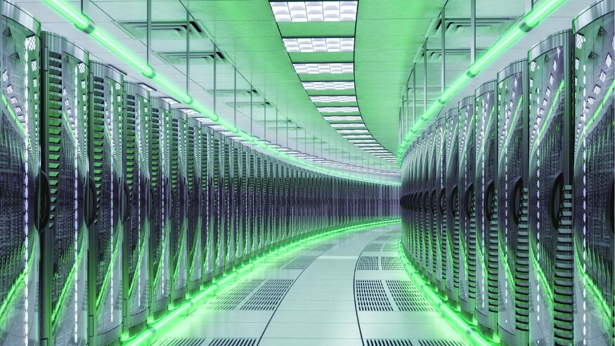 A futuristic data center illuminated with green LED lights, creating a high-tech ambiance.